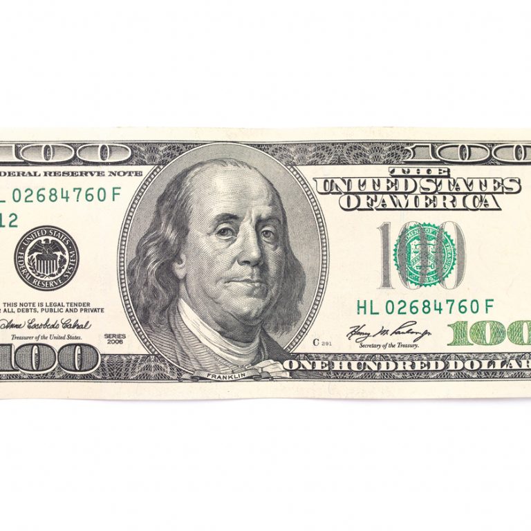One hundred dollars isolated on white background. Top view.