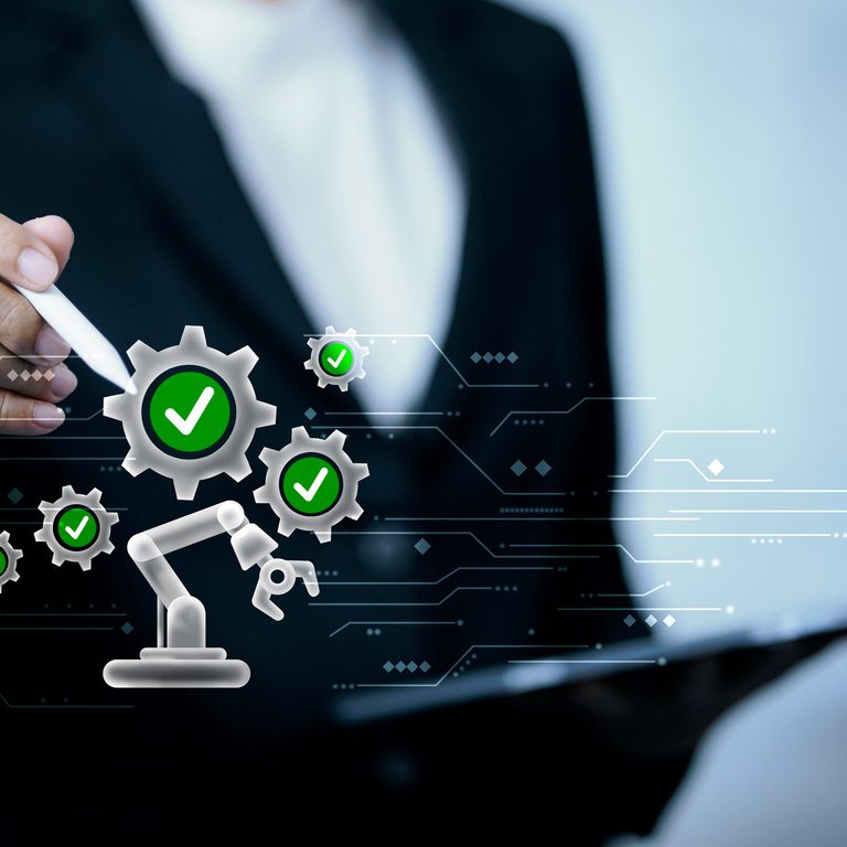 Hand using stylus with automation system, robotic arm, and quality check icons, representing process optimization, quality control, business efficiency, and industrial automation technology.